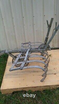 Vintage one horse drawn cultivator for garden with single tree